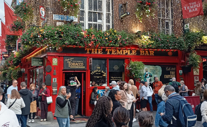 Exploring the vibrant streets and colorful shopfronts of Temple Bar in Dublin with Dublin Walkabout Tours.