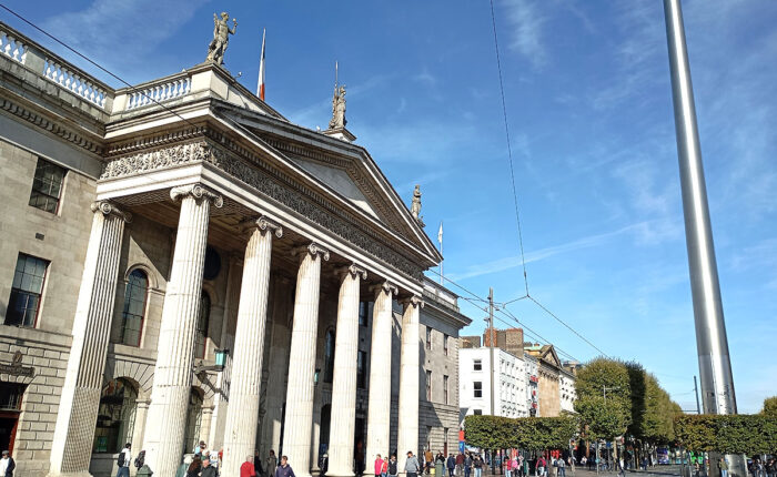 Looking down O'Connell Street at the GPO and the Spire with Dublin Walkabout Tours.