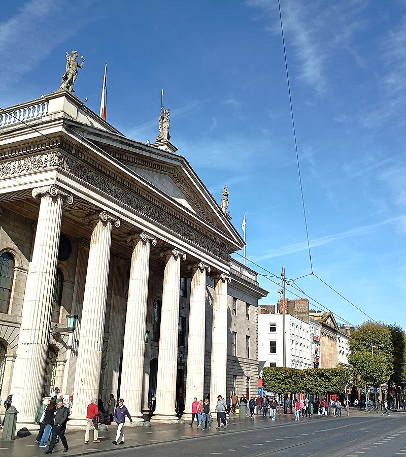 Looking down O'Connell Street at the GPO and the Spire with Dublin Walkabout Tours.