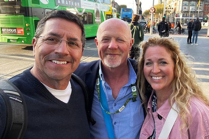 O Connell Bridge Dublin with local tour guide David posing for a photo with guests on a private walking tour