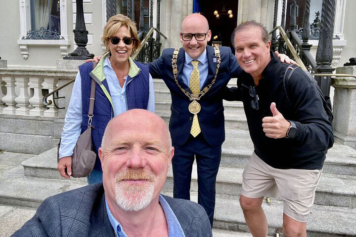 Lord Mayor of Dublin poses for a photo on the steps of the mansion house with local guide David and his guests