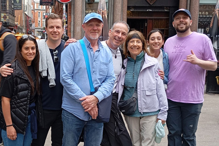 Group enjoying a private walking tour stop at The Stag's Head Pub with guide David.