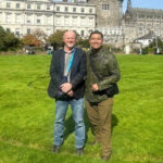 Tour guest with local guide David standing in the Dubh Linn gardens at the back of Dublin Castle